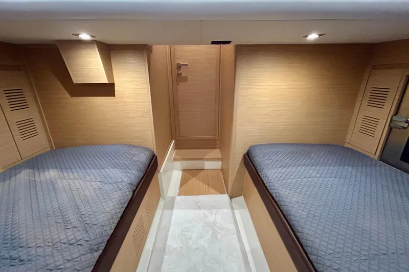 Odessa Mama Yacht Photos Pics Interior cabin of 2023 Pardo Yachts 43 with twin beds and wooden finish.