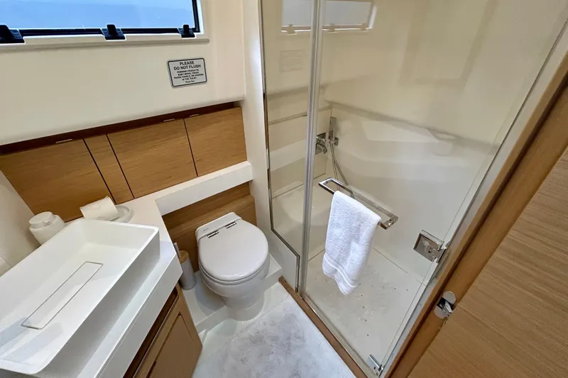 Odessa Mama Yacht Photos Pics Luxurious bathroom in 2023 Pardo Yachts 43, featuring modern fixtures and glass shower.