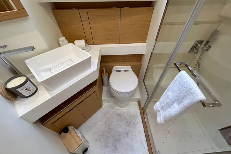 Odessa Mama Yacht Photos Pics Modern bathroom in 2023 Pardo Yachts 43, featuring sleek fixtures and wooden accents.