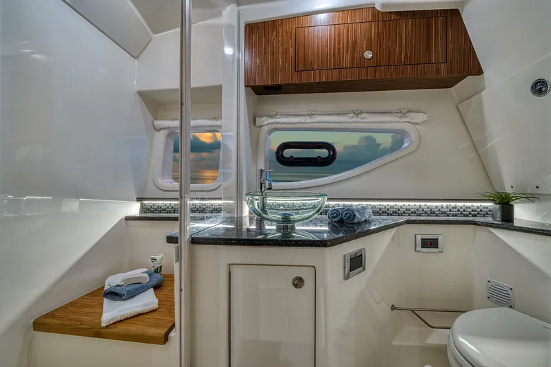  Yacht Photos Pics Manufacturer Provided Image: Luxurious bathroom in 2022 Sea Ray Sundancer 370 OB yacht with modern fixtures.