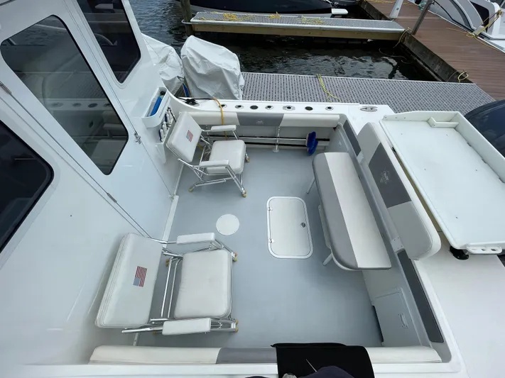  Yacht Photos Pics 2021 Steiger Craft 28 DV Chesapeake boat interior with seating and storage.