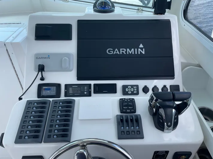  Yacht Photos Pics Steiger Craft 28 DV Chesapeake 2021 boat dashboard with Garmin navigation system and control panel.
