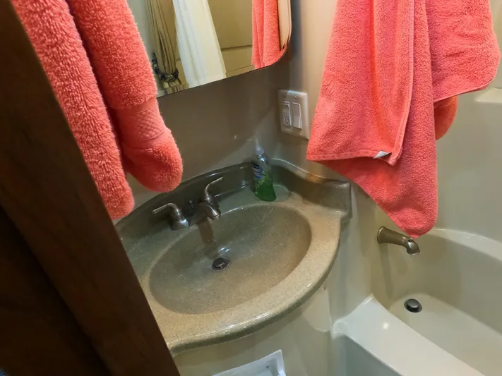  Yacht Photos Pics Bathroom sink and tub in 2006 Bluewater Yachts 5200, with pink towels.