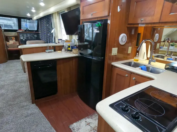  Yacht Photos Pics Interior of 2006 Bluewater Yachts 5200, featuring kitchen with modern appliances and cozy living space.