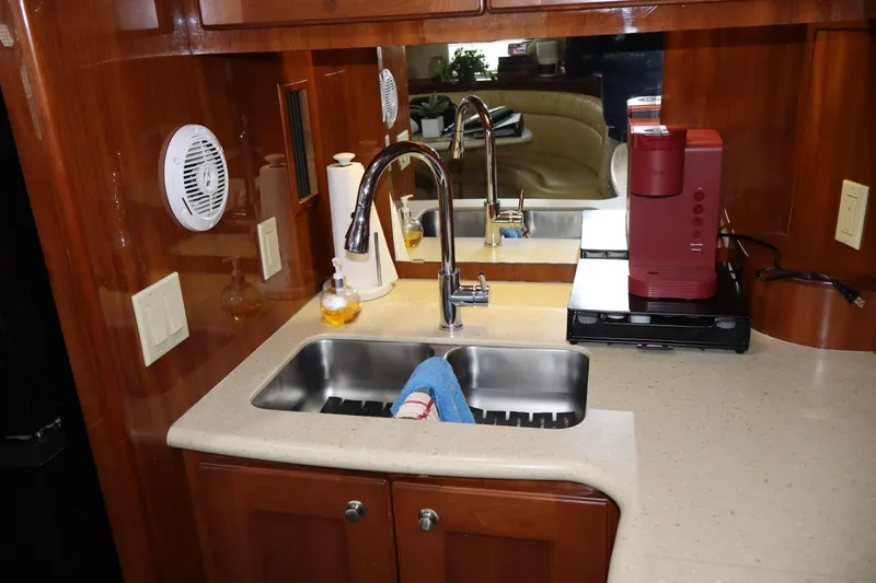  Yacht Photos Pics 2006 Bluewater Yachts 5200 kitchen with sink, faucet, and coffee maker.