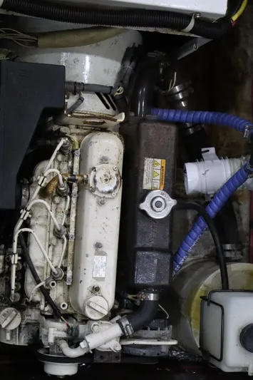  Yacht Photos Pics Engine compartment of a 2006 Bluewater Yachts 5200, showcasing mechanical components and hoses.