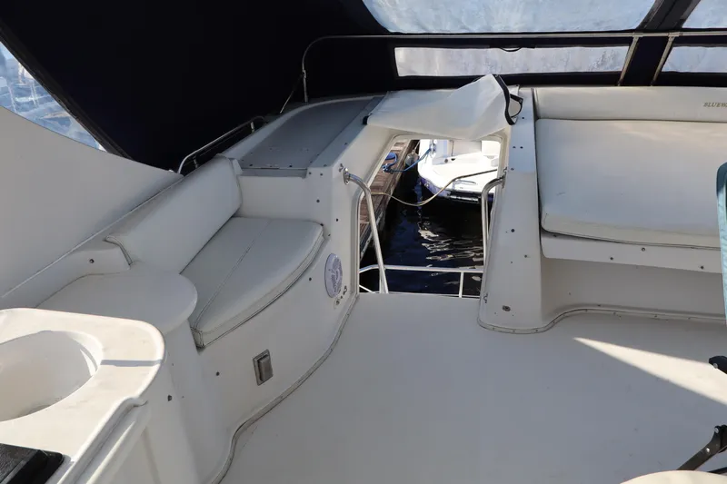  Yacht Photos Pics Interior view of 2006 Bluewater Yachts 5200, featuring seating and open deck area.