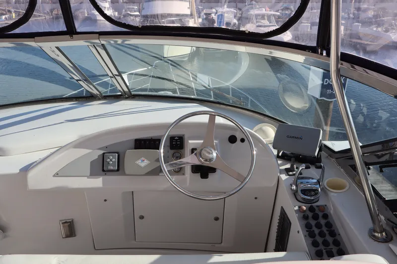  Yacht Photos Pics Helm of 2006 Bluewater Yachts 5200, featuring steering wheel and navigation equipment.