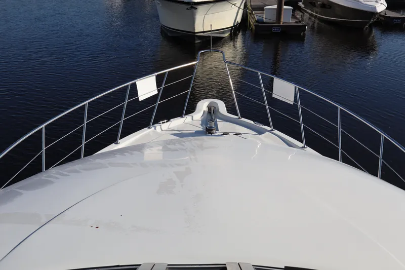  Yacht Photos Pics Bow view of 2006 Bluewater Yachts 5200, docked in a marina.