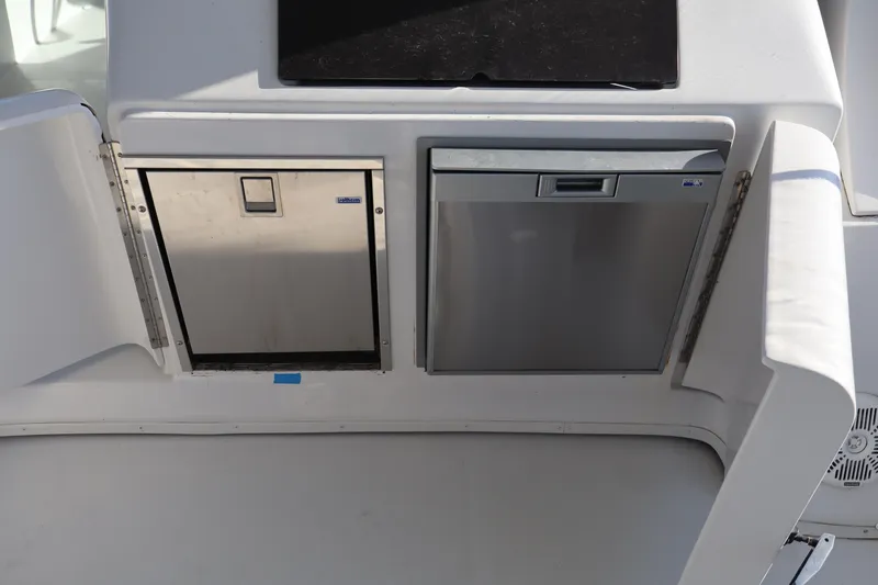  Yacht Photos Pics 2006 Bluewater Yachts 5200 interior with stainless steel appliances and storage compartments.