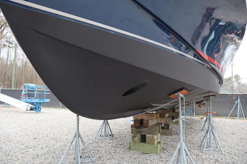  Yacht Photos Pics 2006 Bluewater Yachts 5200 hull on stands, gravel yard setting.