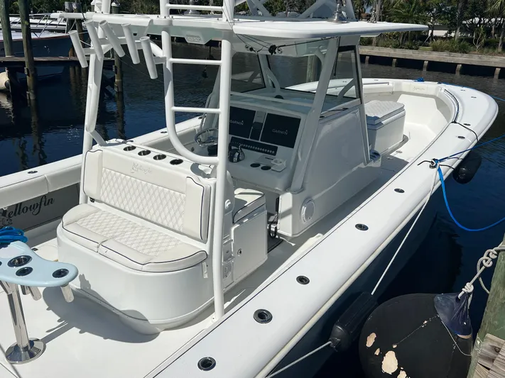 Do Dah Yacht Photos Pics 2017 Yellowfin 39 Offshore boat docked, featuring spacious seating and modern controls.