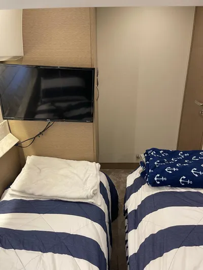  Yacht Photos Pics Twin beds with striped bedding in a 2018 Prestige 500 S yacht cabin.