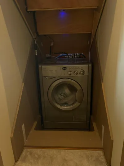  Yacht Photos Pics Washing machine in compact wooden alcove on a Prestige 500 S, 2018 model.