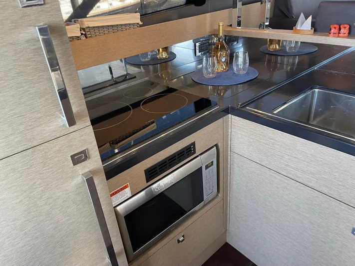  Yacht Photos Pics Modern kitchen in 2018 Prestige 500 S yacht with microwave and glassware.