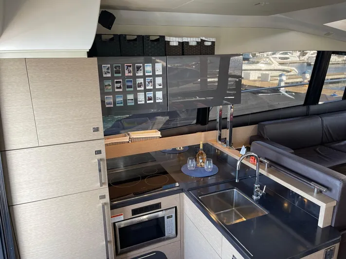  Yacht Photos Pics Modern kitchen interior of 2018 Prestige 500 S yacht with sleek design and appliances.