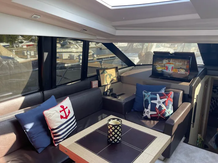  Yacht Photos Pics Luxurious interior of 2018 Prestige 500 S yacht with nautical-themed decor and modern amenities.