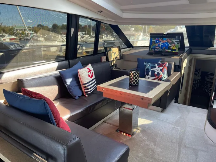  Yacht Photos Pics Luxurious interior of 2018 Prestige 500 S yacht with elegant seating and nautical decor.