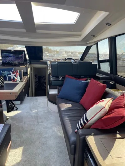  Yacht Photos Pics Luxurious interior of a 2018 Prestige 500 S yacht with plush seating and modern decor.