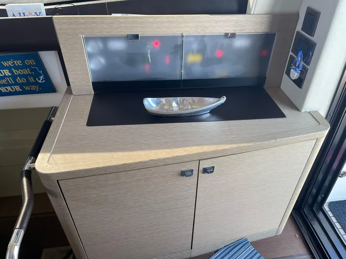  Yacht Photos Pics Modern interior of a 2018 Prestige 500 S yacht with sleek cabinetry and decorative bowl.