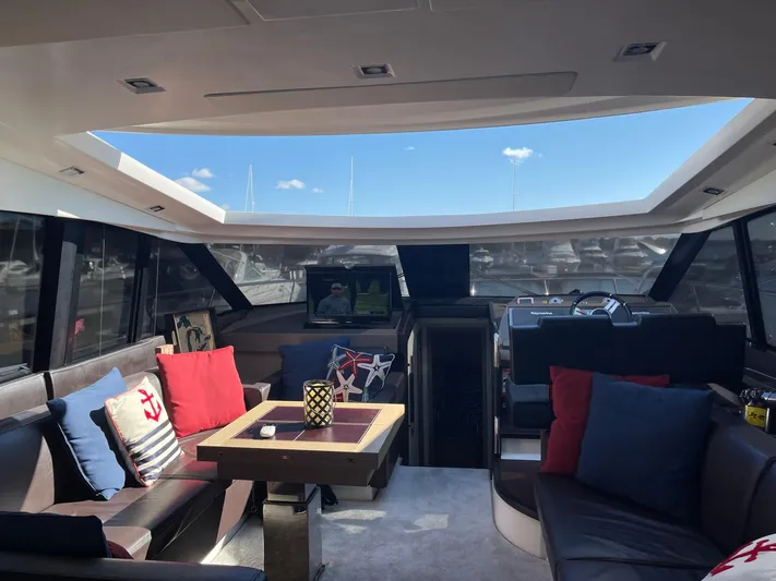  Yacht Photos Pics Luxurious interior of 2018 Prestige 500 S yacht with plush seating and decorative pillows.