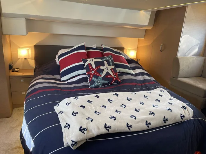  Yacht Photos Pics Luxurious bedroom in 2018 Prestige 500 S yacht with nautical-themed bedding.