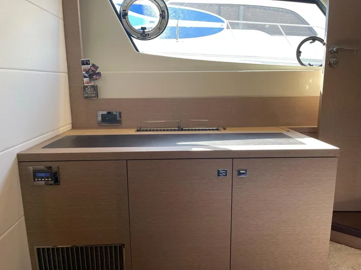  Yacht Photos Pics Modern kitchen area in a 2018 Prestige 500 S yacht with sleek cabinetry.