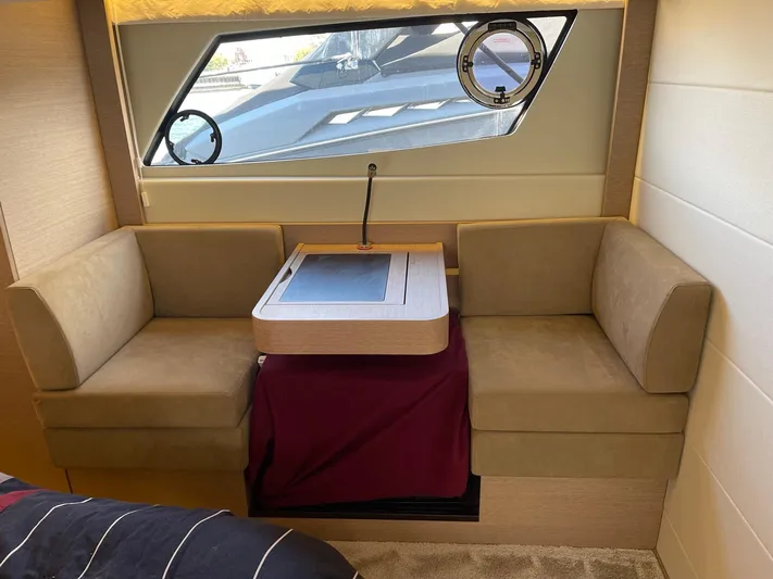  Yacht Photos Pics Luxurious interior of 2018 Prestige 500 S yacht with cozy seating and window view.