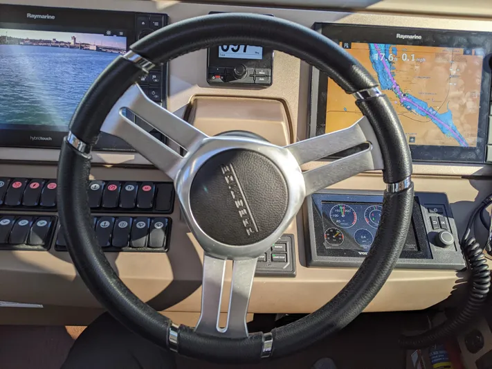  Yacht Photos Pics Steering wheel and dashboard of 2018 Prestige 500 S yacht with navigation screens.