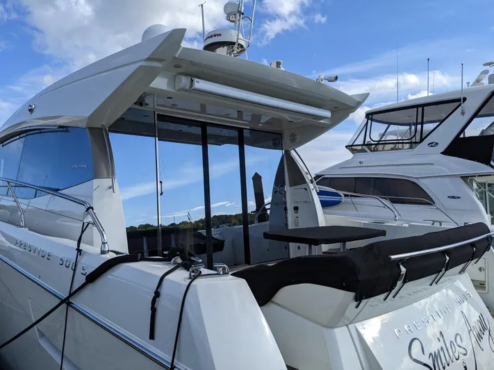  Yacht Photos Pics 2018 Prestige 500 S yacht docked under a clear blue sky.
