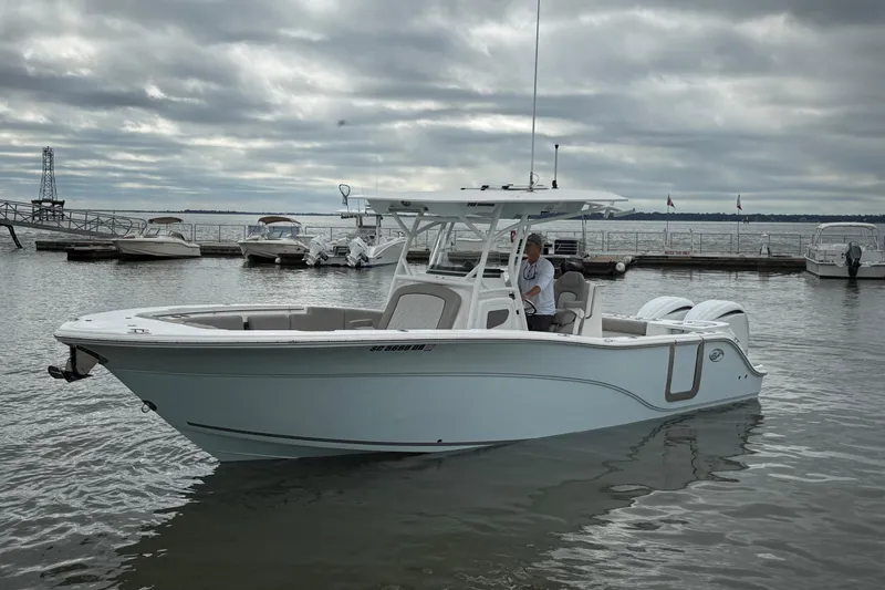  Yacht Photos Pics 2022 Sea Fox 288 Commander boat docked on a cloudy day at a marina.
