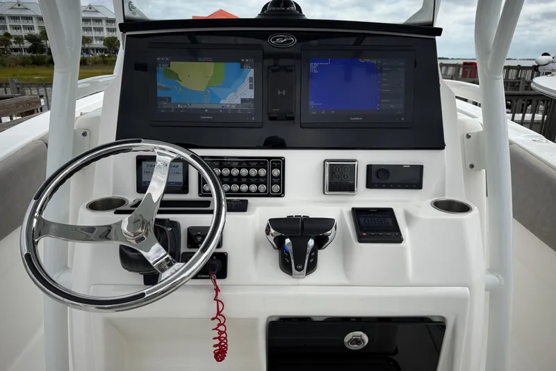 Yacht Photos Pics 2022 Sea Fox 288 Commander boat dashboard with steering wheel and navigation screens.