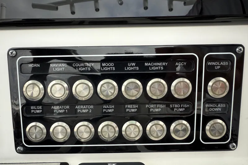  Yacht Photos Pics Control panel of a 2022 Sea Fox 288 Commander boat with labeled switches.