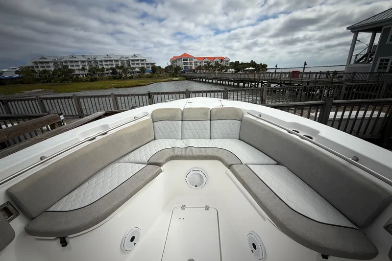  Yacht Photos Pics 2022 Sea Fox 288 Commander boat interior with cushioned seating, dockside view.