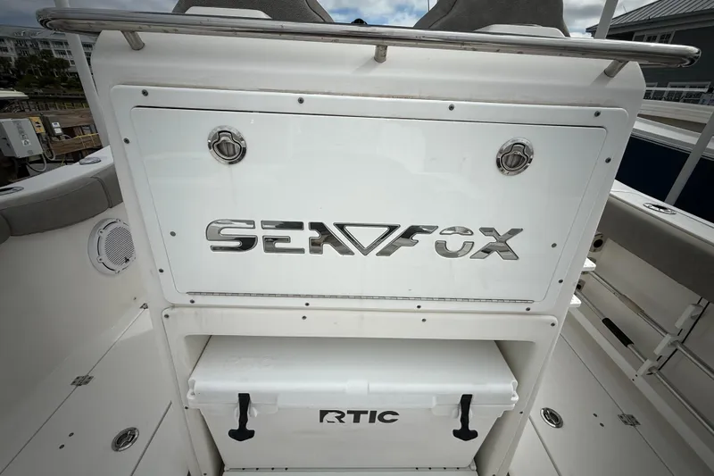  Yacht Photos Pics 2022 Sea Fox 288 Commander boat interior with RTIC cooler and branded panel.