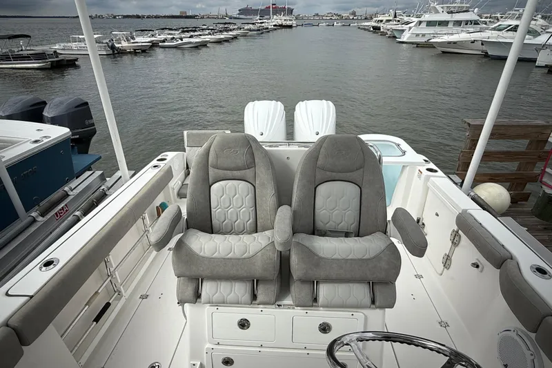  Yacht Photos Pics 2022 Sea Fox 288 Commander boat interior with dual captain's chairs at marina.