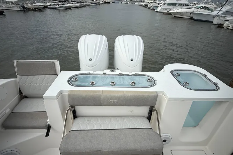  Yacht Photos Pics 2022 Sea Fox 288 Commander boat interior with dual engines and seating at marina.