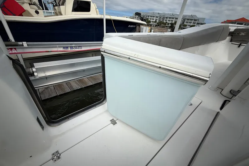  Yacht Photos Pics 2022 Sea Fox 288 Commander boat interior with seating and storage compartment.