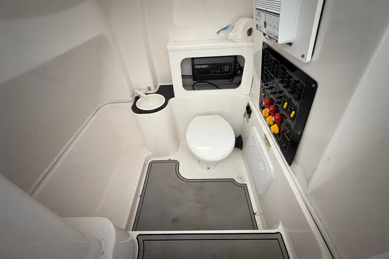  Yacht Photos Pics 2022 Sea Fox 288 Commander boat interior with toilet and control panel.
