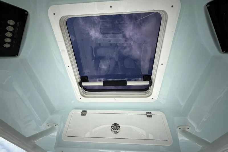  Yacht Photos Pics 2022 Sea Fox 288 Commander boat interior with skylight and storage compartment.