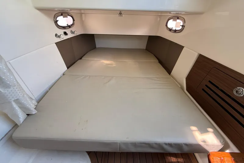 Gail Force Yacht Photos Pics 2023 Boston Whaler 360 Outrage cabin interior with comfortable sleeping area.