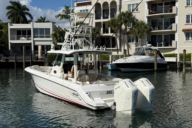 Gail Force Yacht Photos Pics 2023 Boston Whaler 360 Outrage boat docked near waterfront residences.