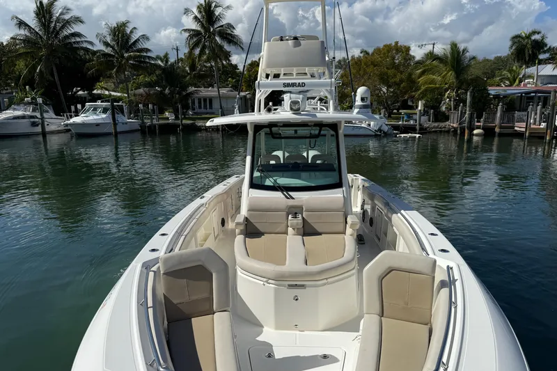 Gail Force Yacht Photos Pics 2023 Boston Whaler 360 Outrage boat docked in a scenic marina setting.