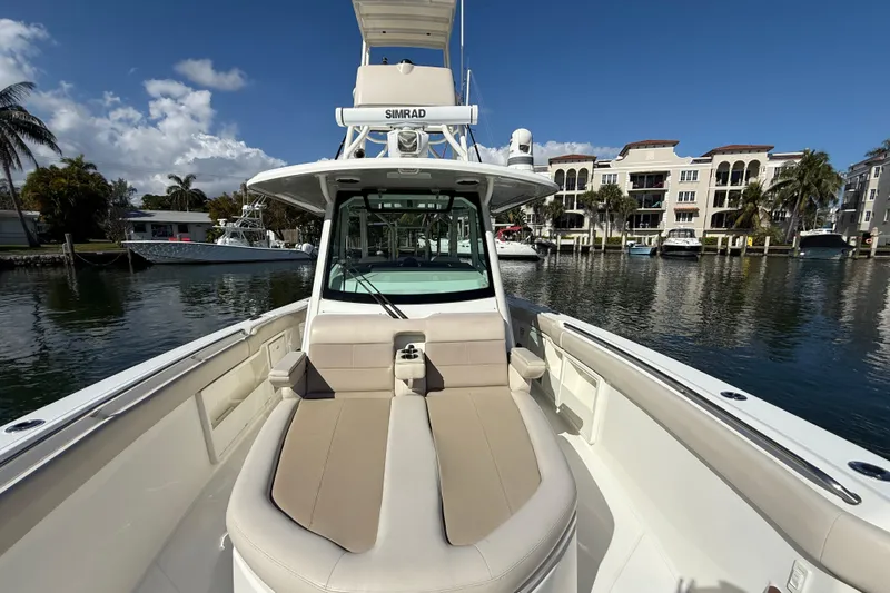 Gail Force Yacht Photos Pics 2023 Boston Whaler 360 Outrage boat docked in a scenic marina setting.