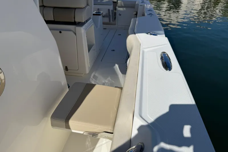 Gail Force Yacht Photos Pics 2023 Boston Whaler 360 Outrage boat interior with seating and water view.