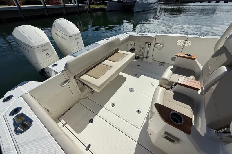 Gail Force Yacht Photos Pics 2023 Boston Whaler 360 Outrage boat interior with seating and twin Mercury engines.
