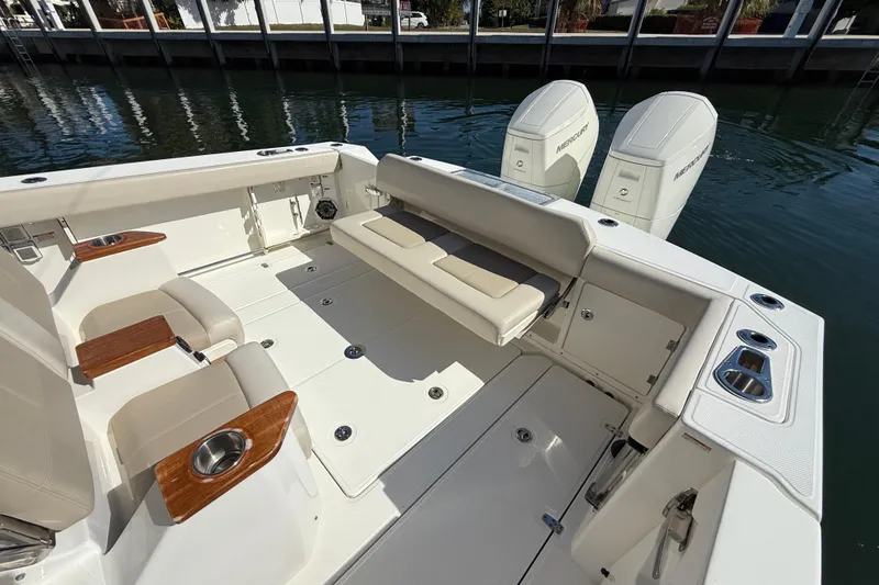 Gail Force Yacht Photos Pics 2023 Boston Whaler 360 Outrage boat interior with seating and twin Mercury engines.