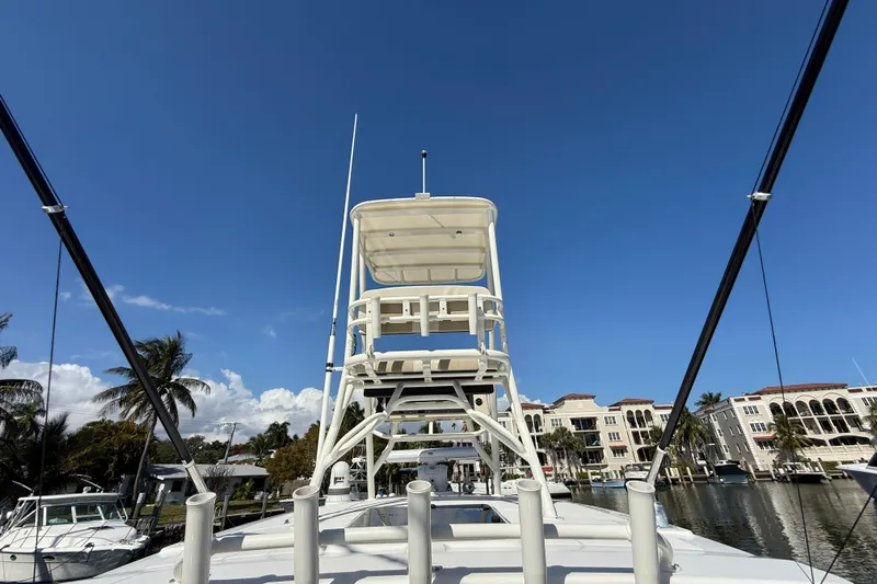 Gail Force Yacht Photos Pics 2023 Boston Whaler 360 Outrage boat with tower against clear blue sky.