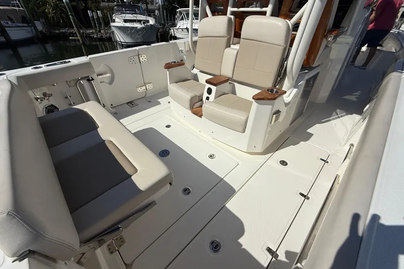 Gail Force Yacht Photos Pics 2023 Boston Whaler 360 Outrage interior with beige seating and sleek design.