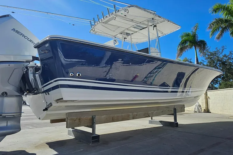  Yacht Photos Pics 2007 SeaCraft SC32 Master Angler boat with Mercury engine, displayed outdoors.